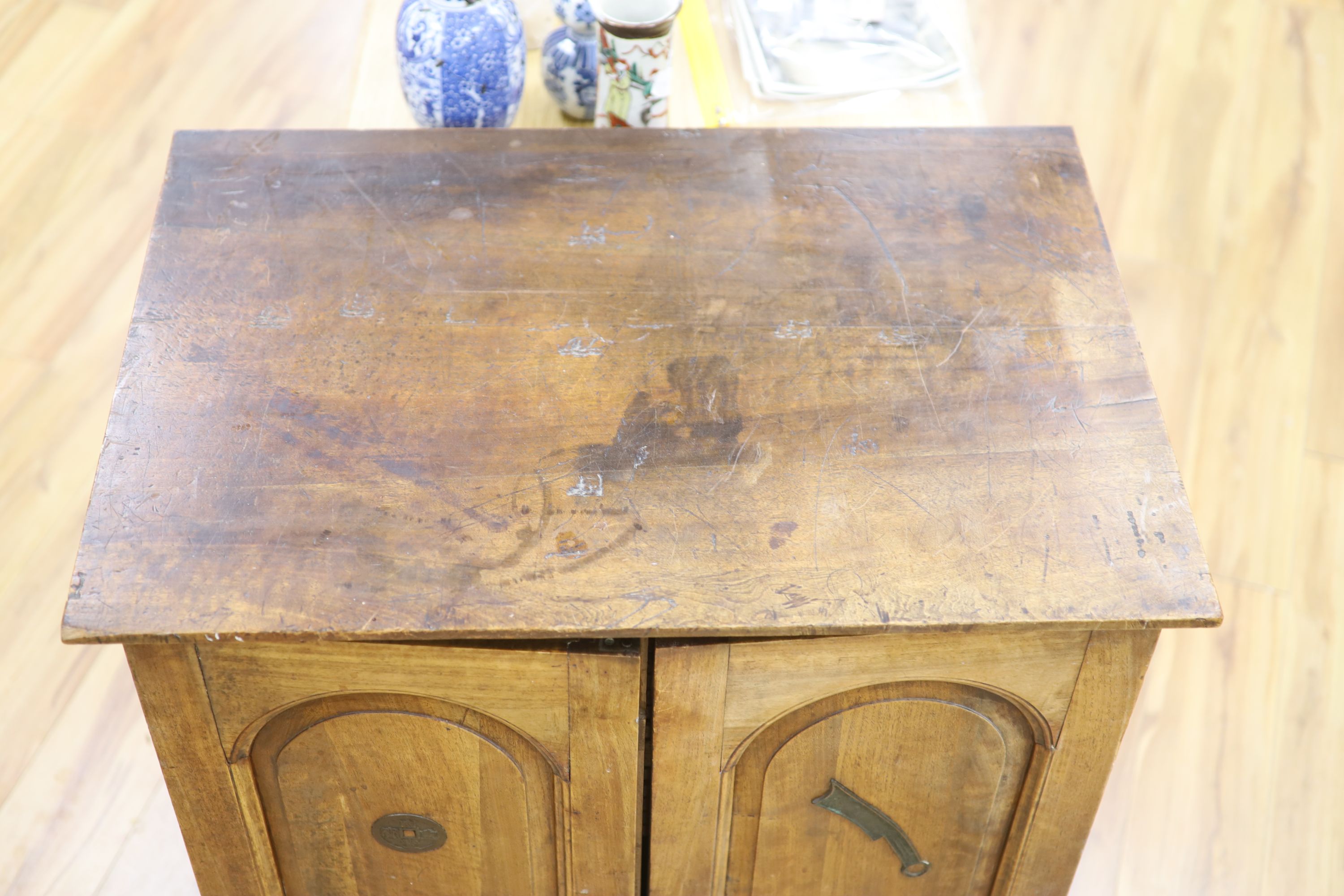 A walnut collectors cabinet for Chinese and Asian amulets and coins, early 20th century,